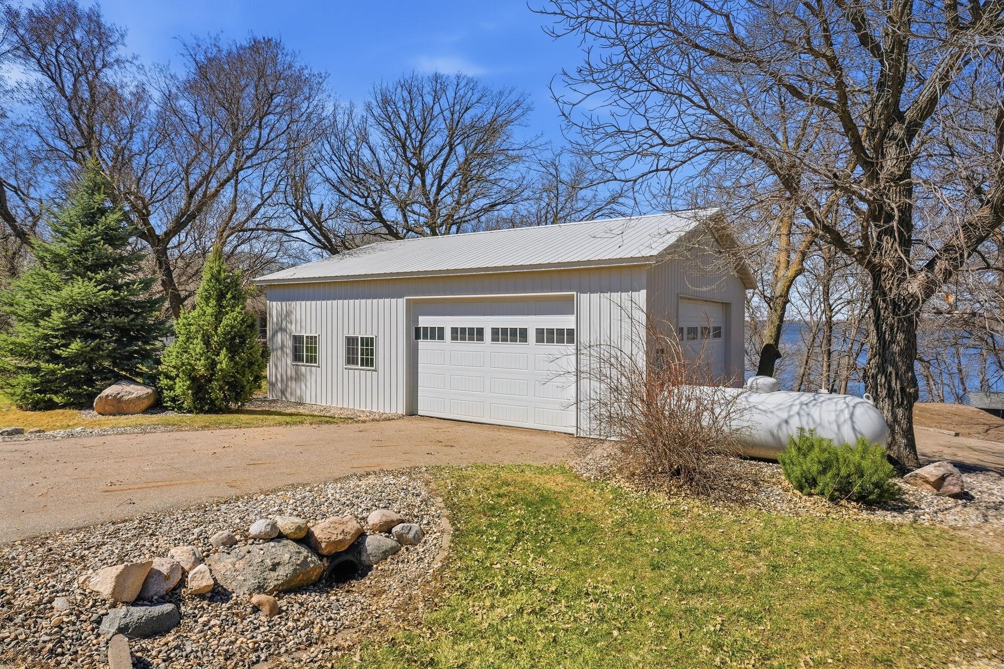 30x40 pole shed with two overhead doors for easy boat storage.