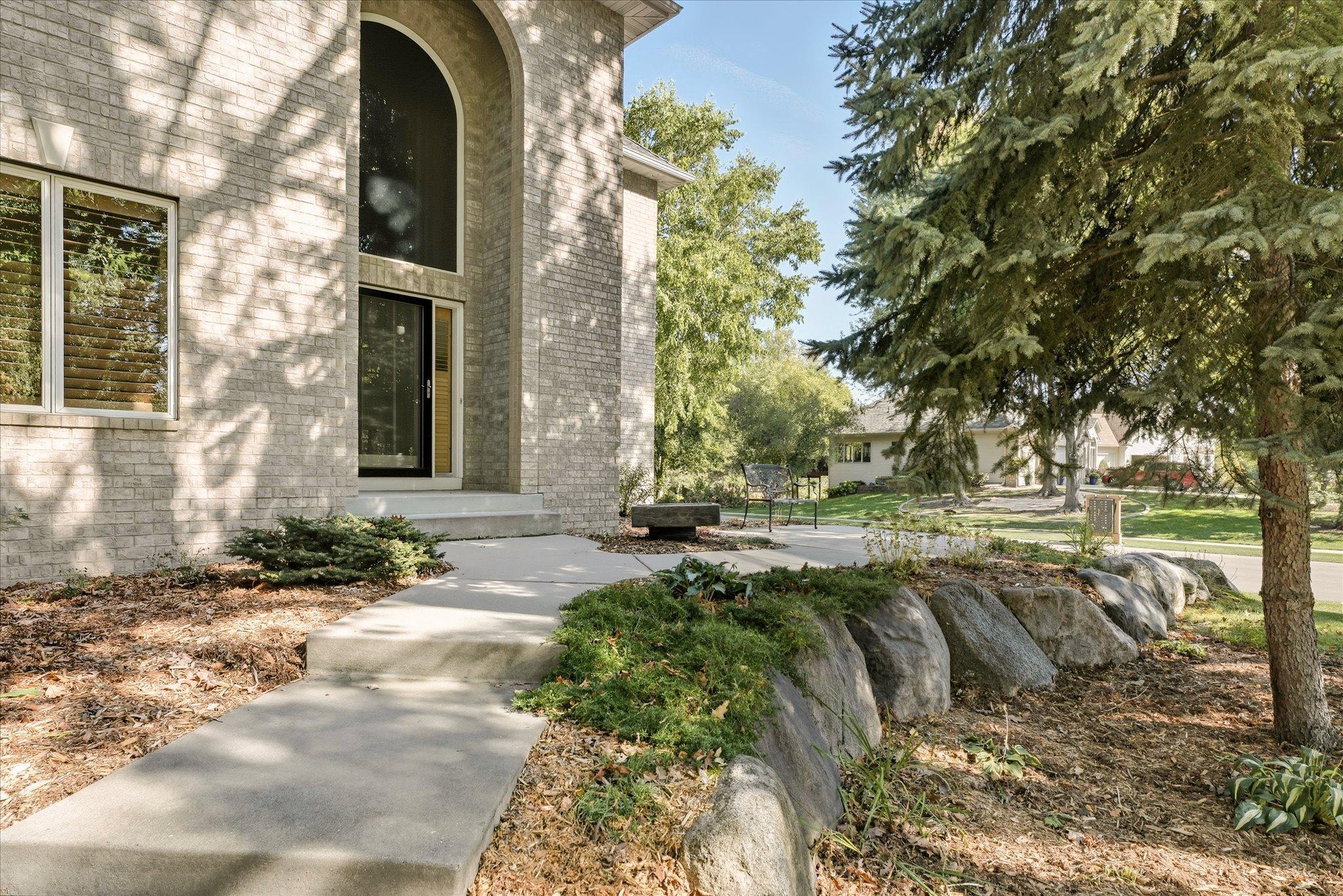 Great curb appeal custom brick exterior. Custom in-soffit down lighting on the brick makes for beautiful night curb appeal. Extra electrical outlets in soffit + near 3rd garage stall for exterior lighting (holidays)