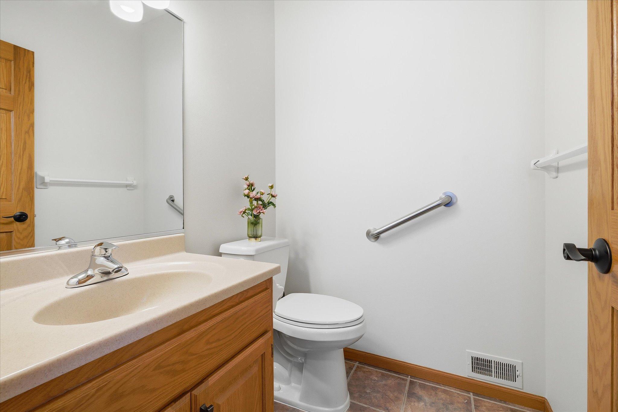 Convenient main level half Bathroom/Powder Room just off the Laundry/Mudroom