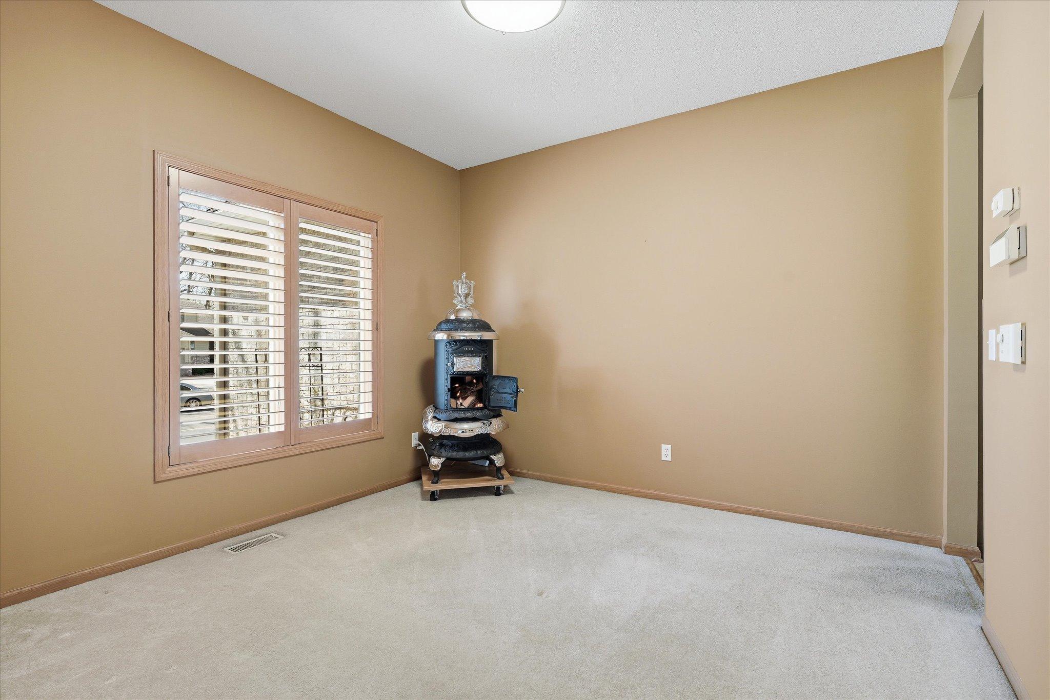 Sun-filled flex room space can be used as an Office or Formal Dining. Easily add future French glass doors