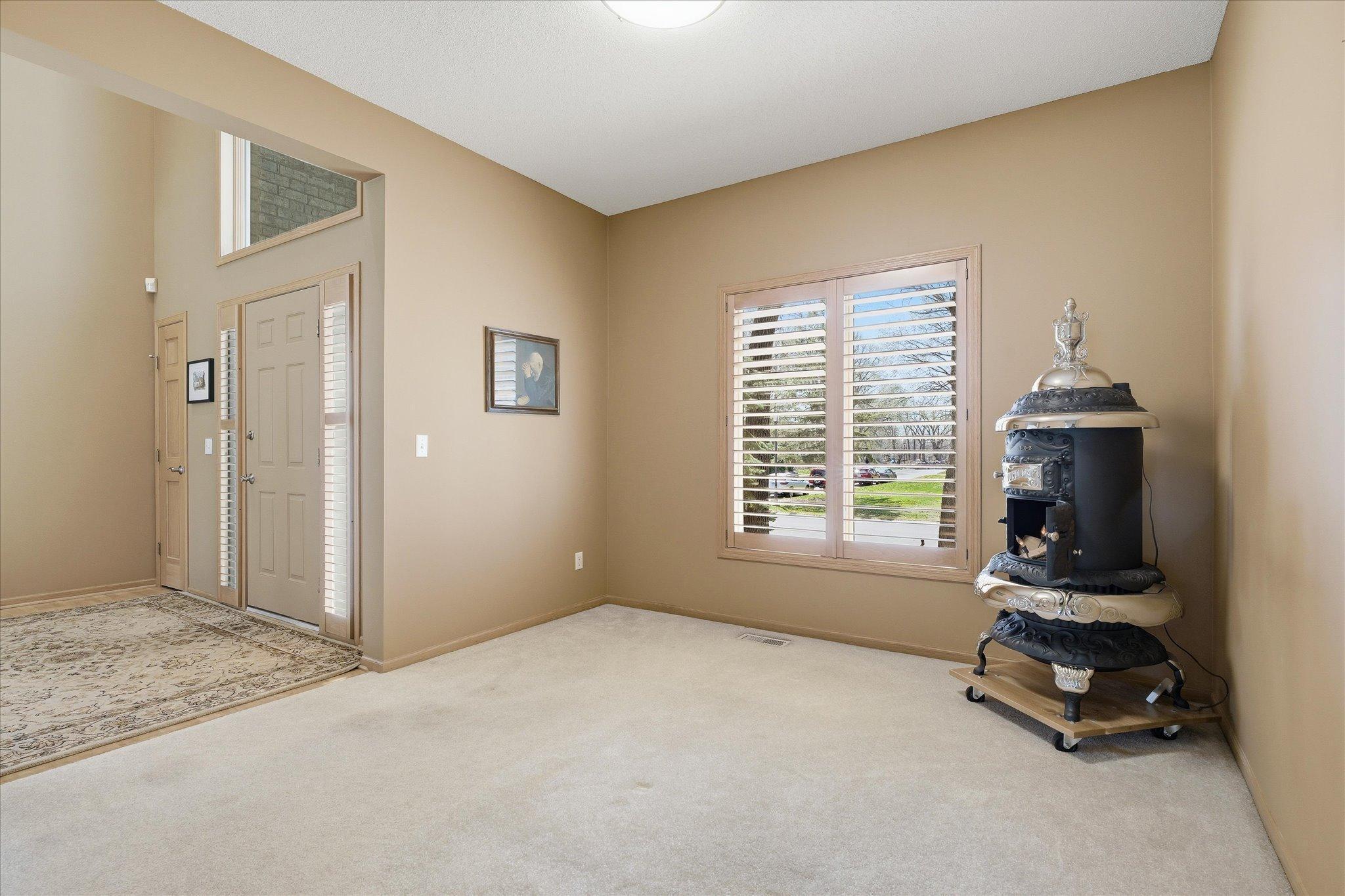 Sun-filled flex room space can be used as an Office or Formal Dining. Easily add future French glass doors