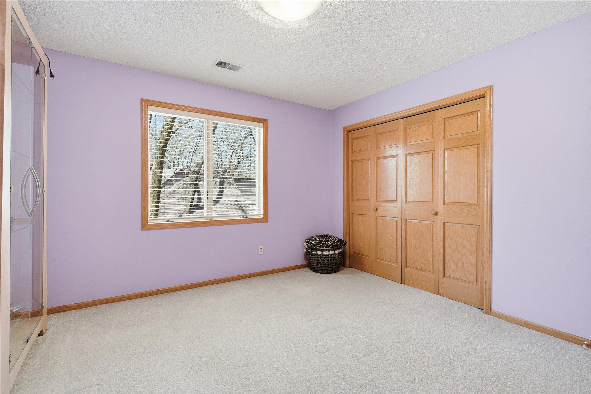 2nd of 4 total upper level bedrooms. Thru the closet wall over garage is an unfinished secret space above garage