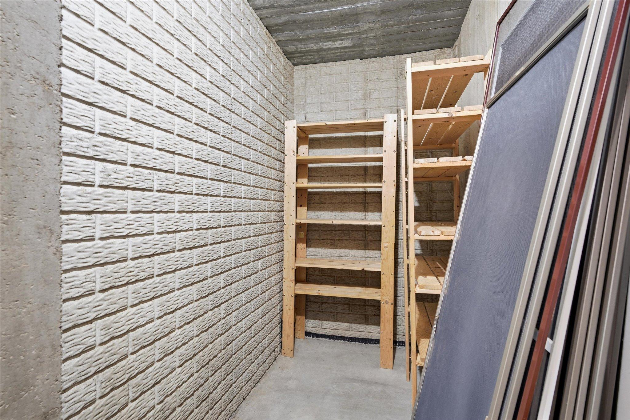 Concrete safe room with concrete walls/ceiling. Could be great wine room or storage room as well