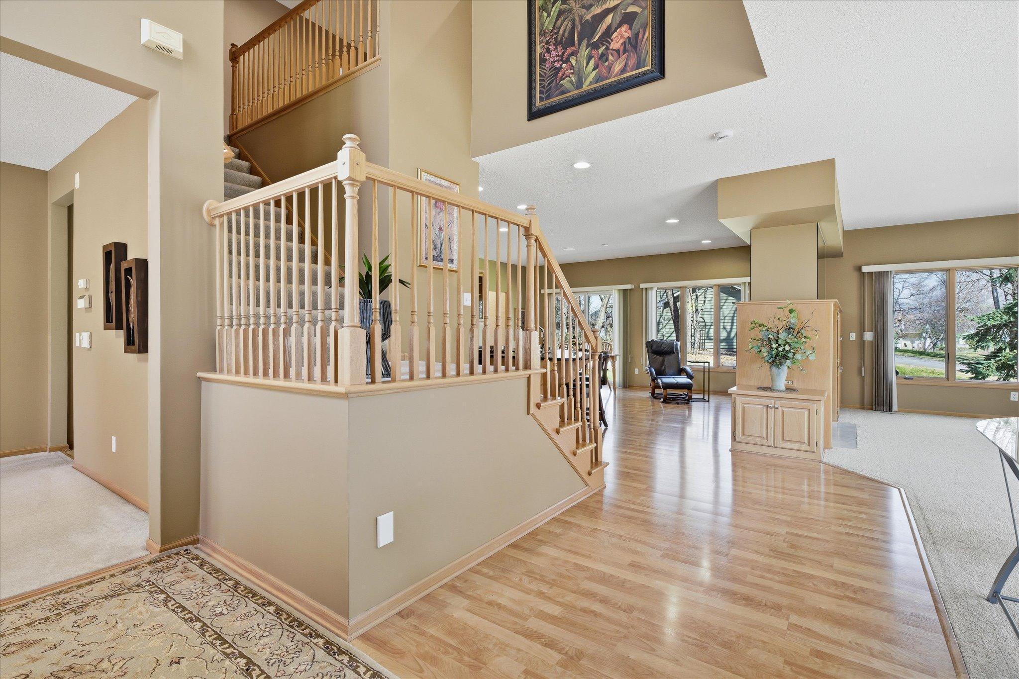Beautiful designed open staircase overlooking Entry and Family Room spaces