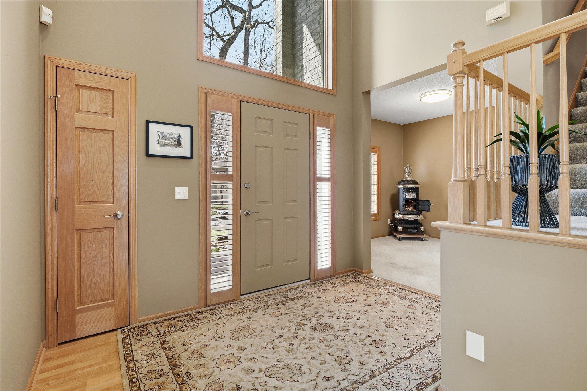 Amazing two Story Entry design w/arched window and matching brick exterior