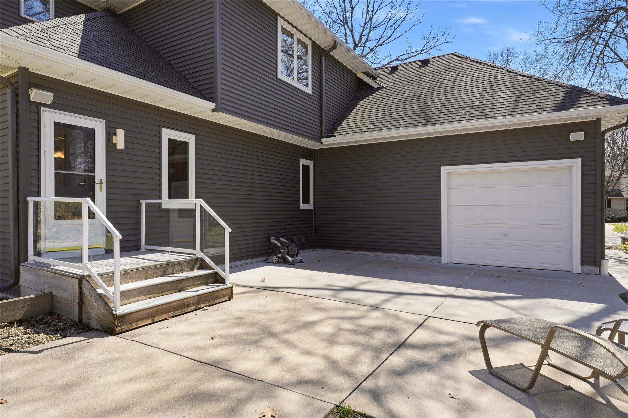 Convenient over-sized rear garage door creates easy open access from back patio to front driveway. Great for entertaining and/or extra storage space for trailers/toys. Easy patio and backyard access thru Mudroom exterior door