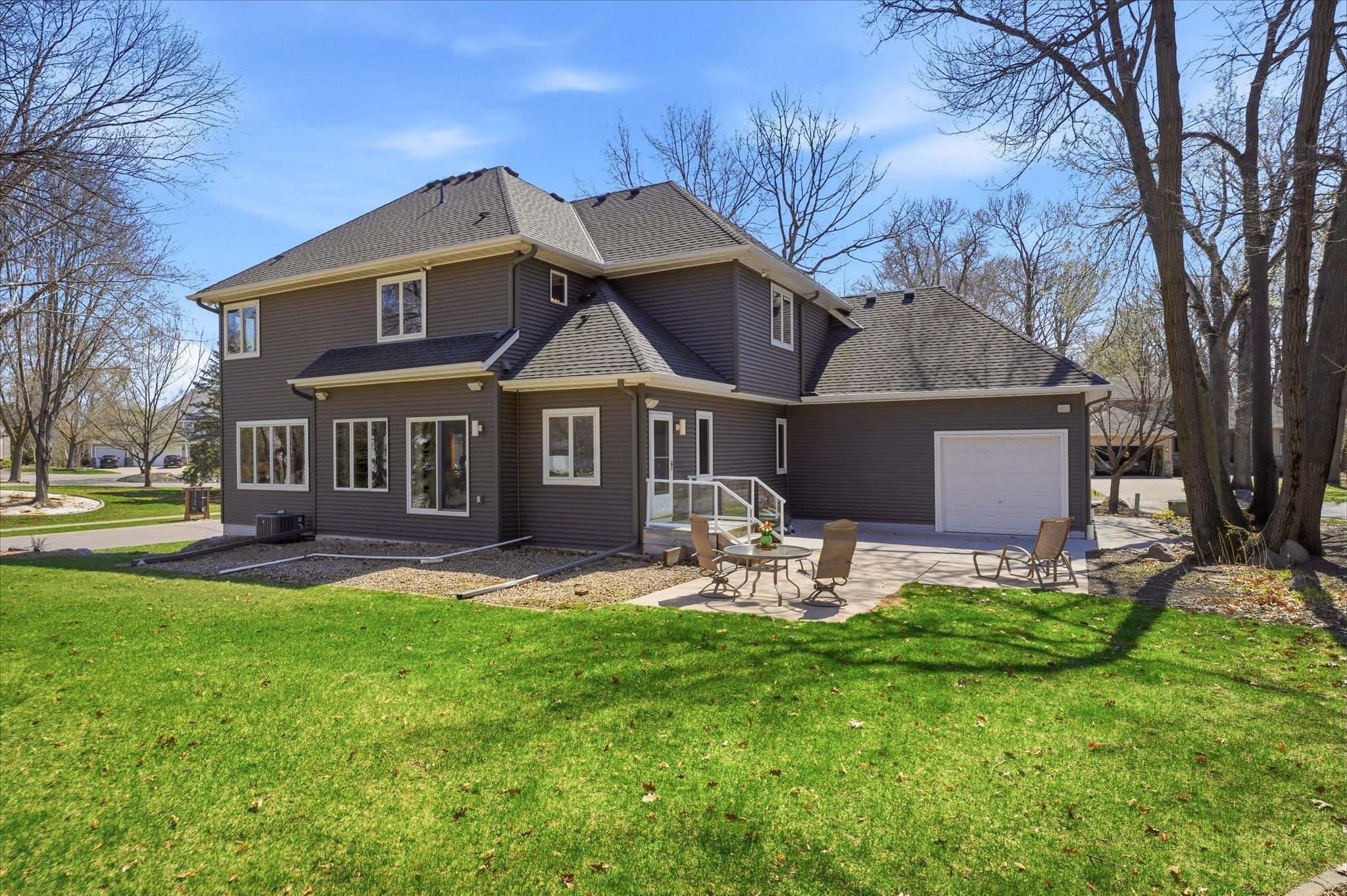 Newer concrete patio (22ftx20ft) behind garage is perfect entertaining area complete w/speakers + easy access to Mudroom/Laundry Room areas