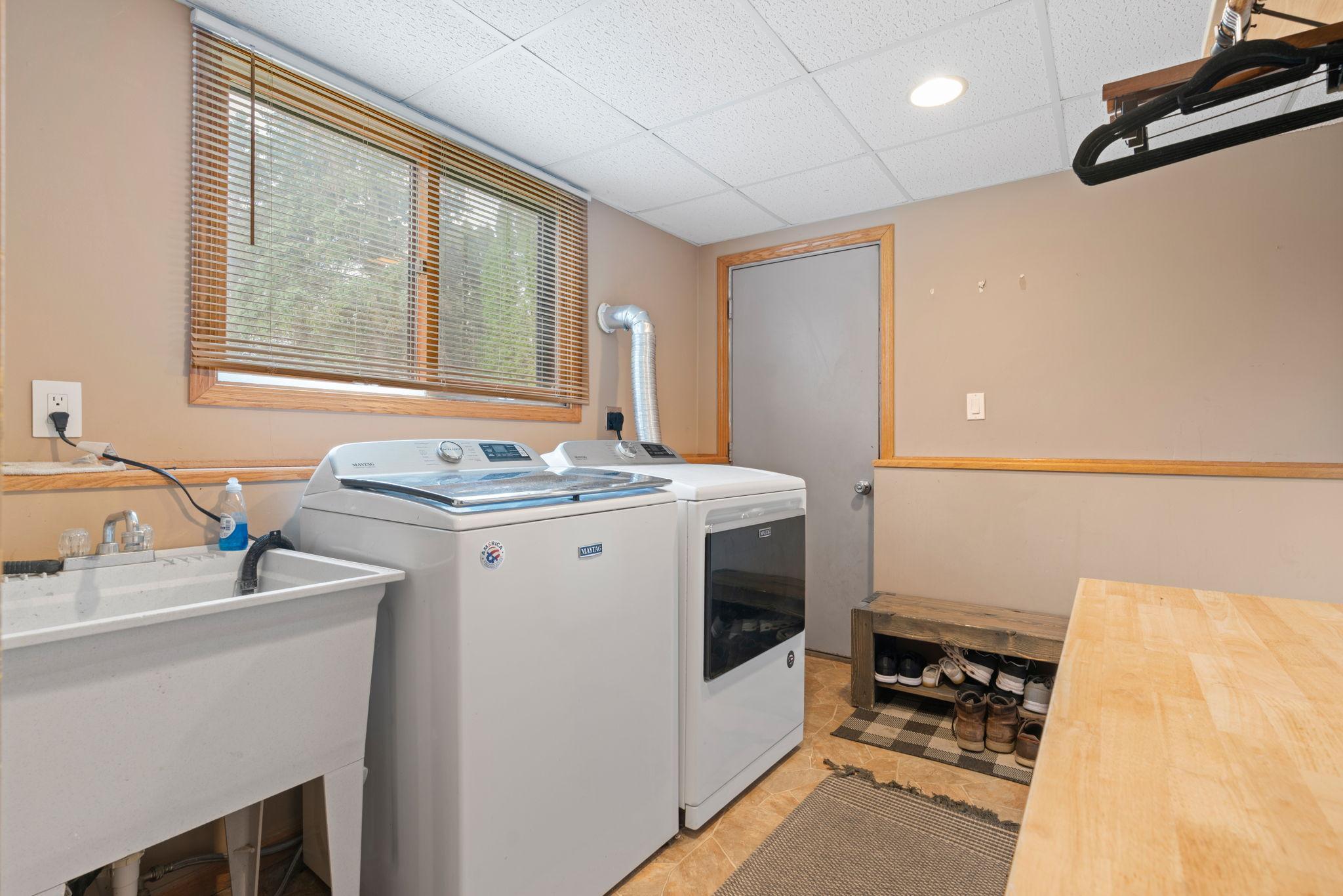 Laundry Room with counter space and utility sink