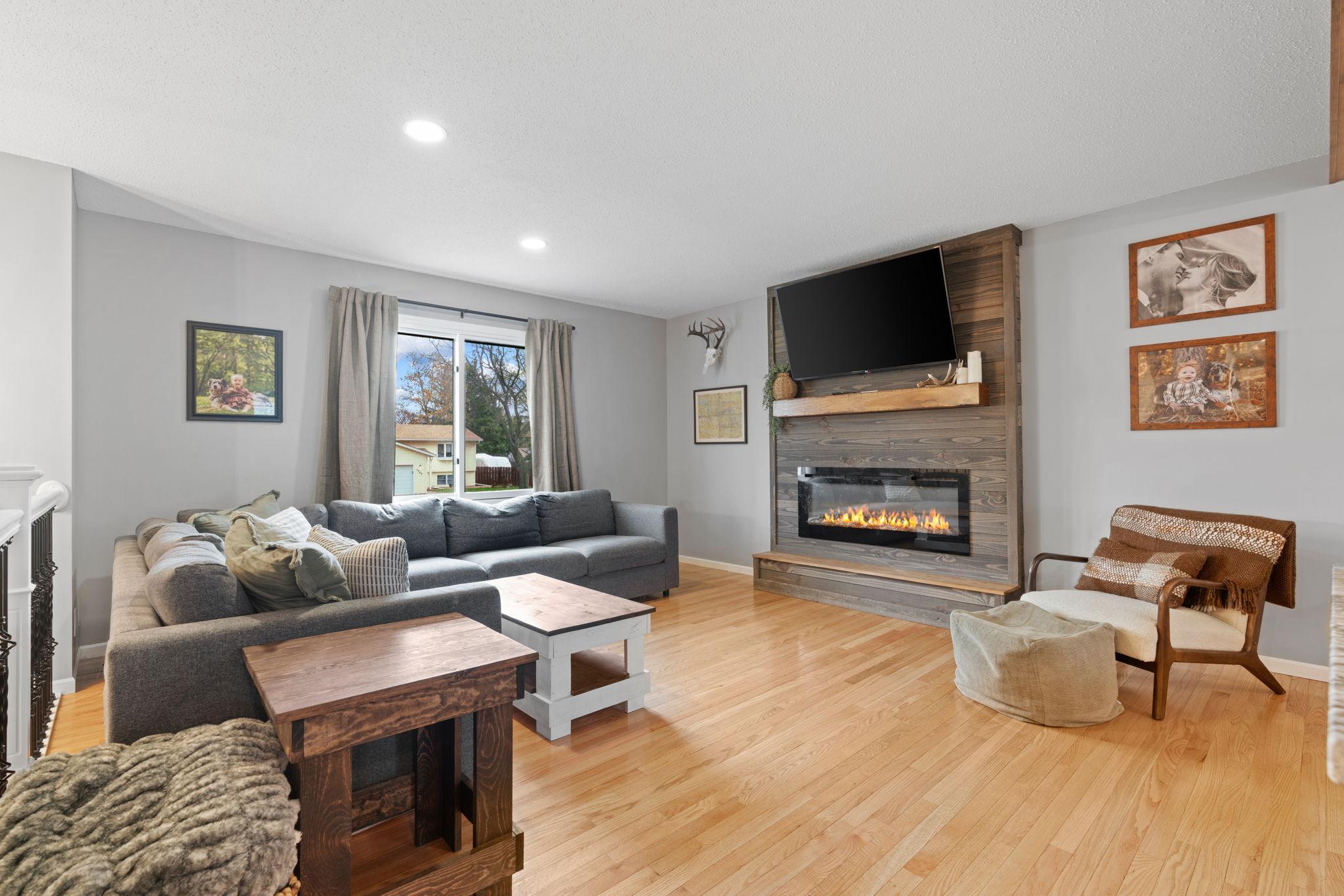 Main Level Living Room with gas fireplace and updated lighting