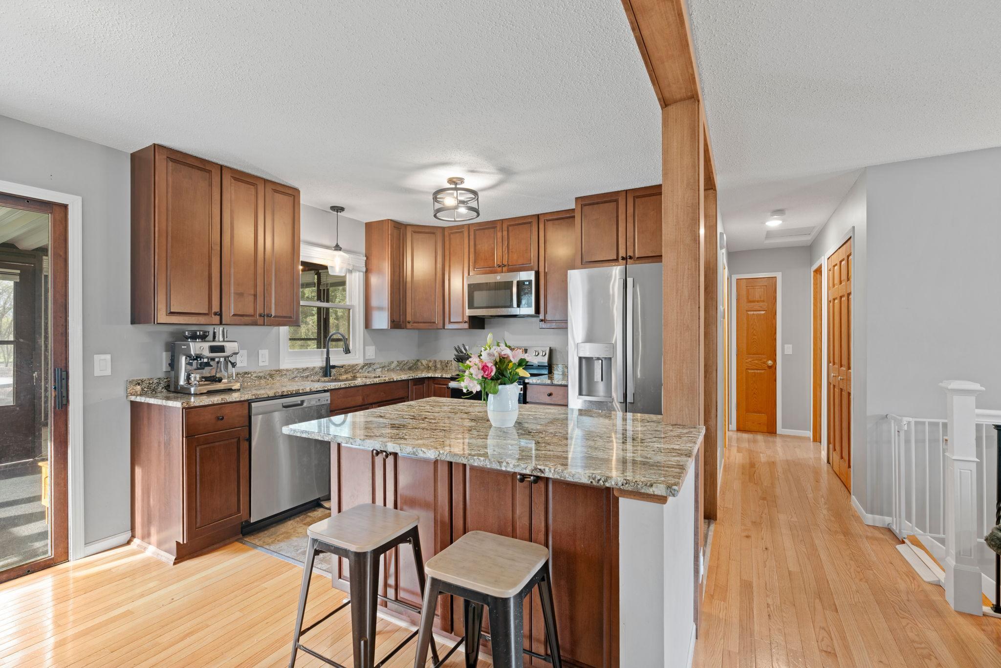 Kitchen with large center island and updated finishes