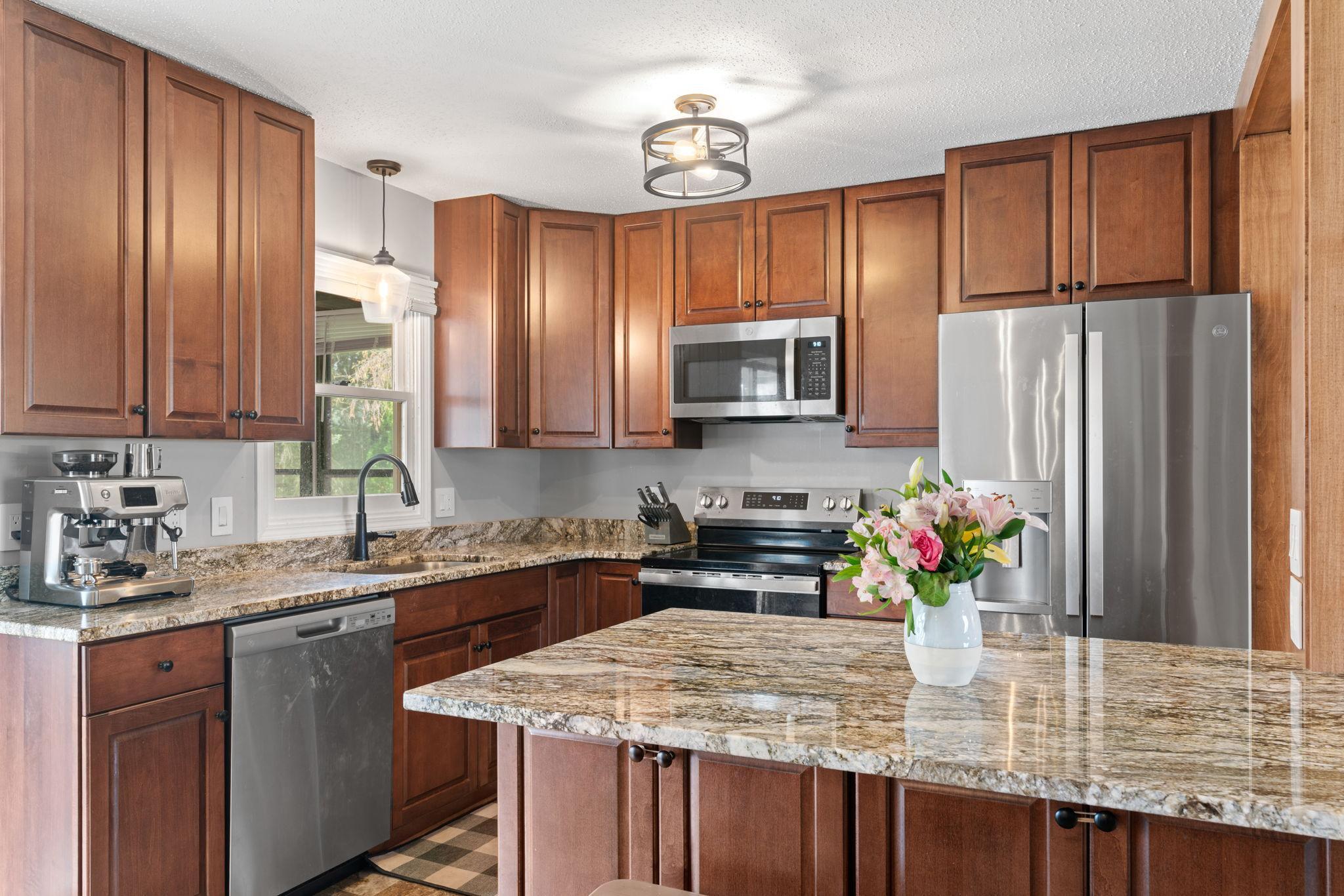 Remodeled Kitchen with granite countertops and stainless appliances