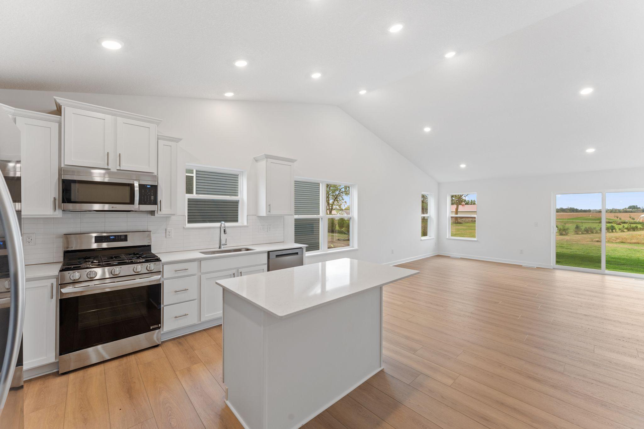Designer-selected cabinetry throughout the kitchen offers ample storage room for dishware and daily culinary essentials