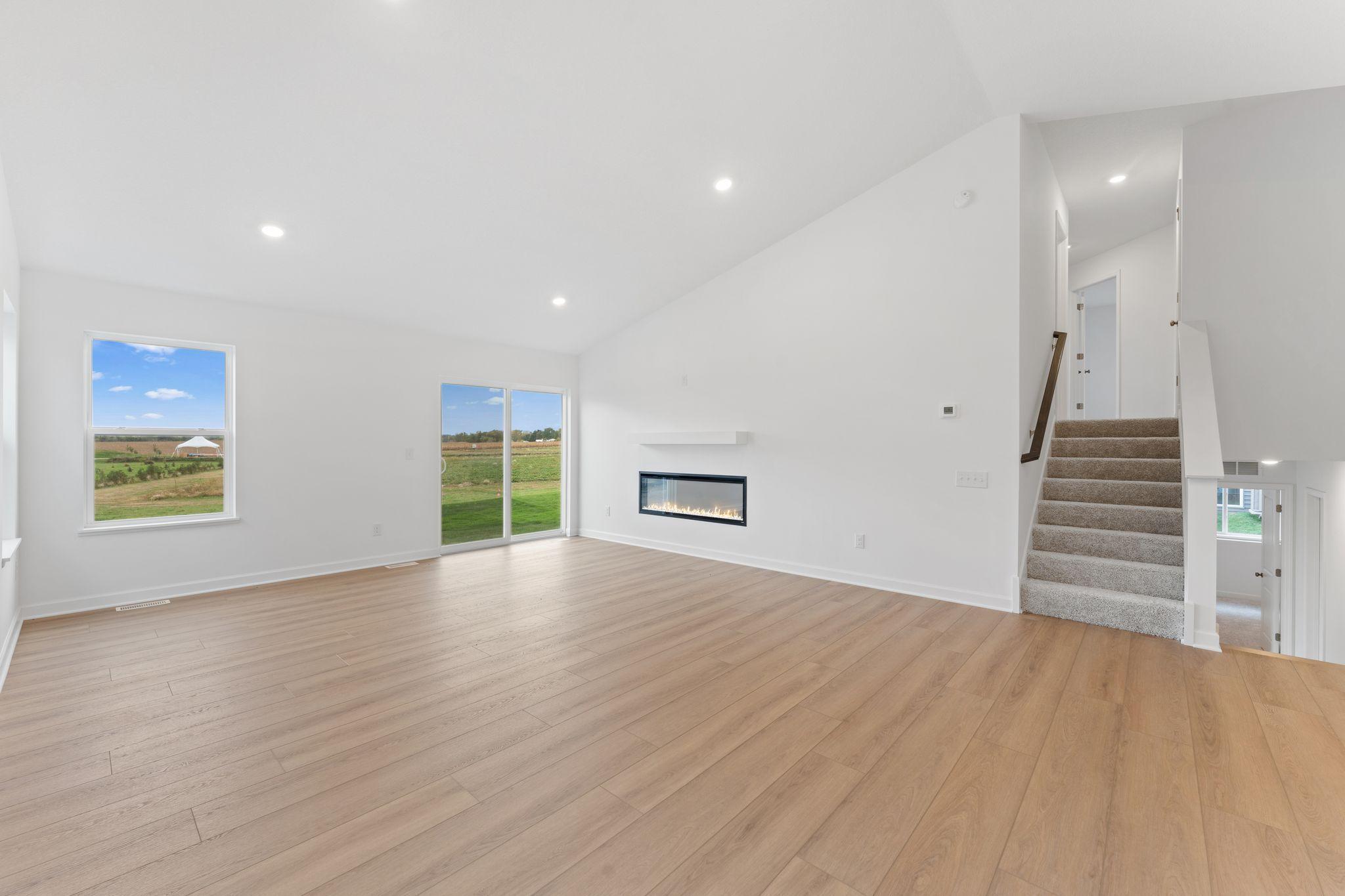 Airy and inviting, the Great Room is ideal for watching movies with the family and hosting special celebrations with guests. Open the adjacent glass-sliders to invite a refreshing breeze throughout the home.