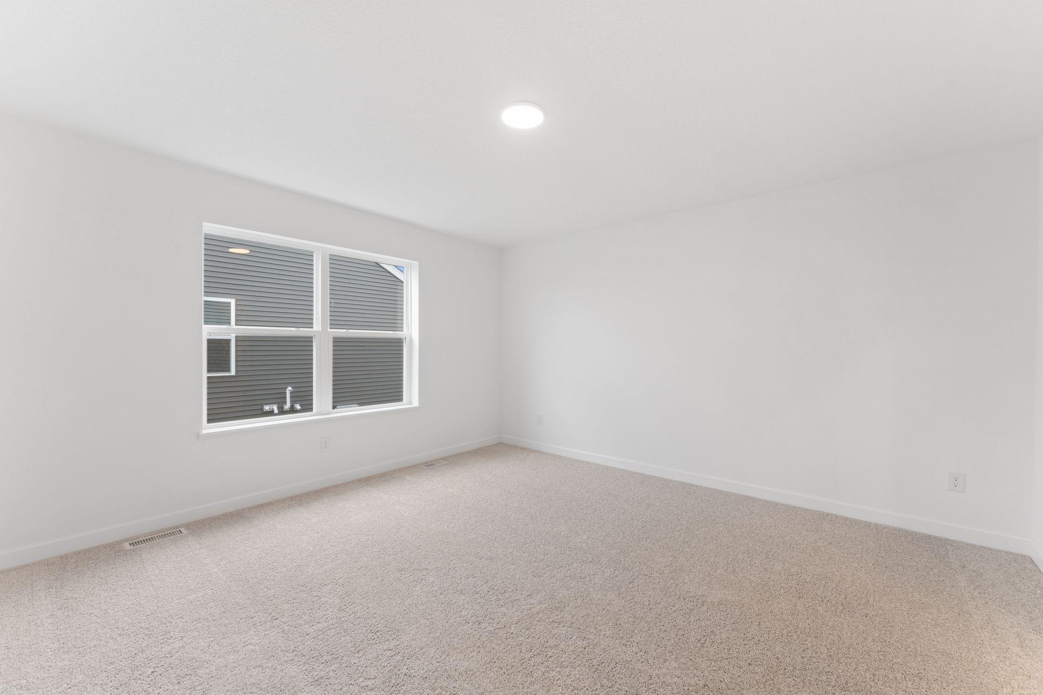 Rest and relaxation await in the owner’s suite, which features a tranquil bedroom, a spa-inspired bathroom and a walk-in closet.