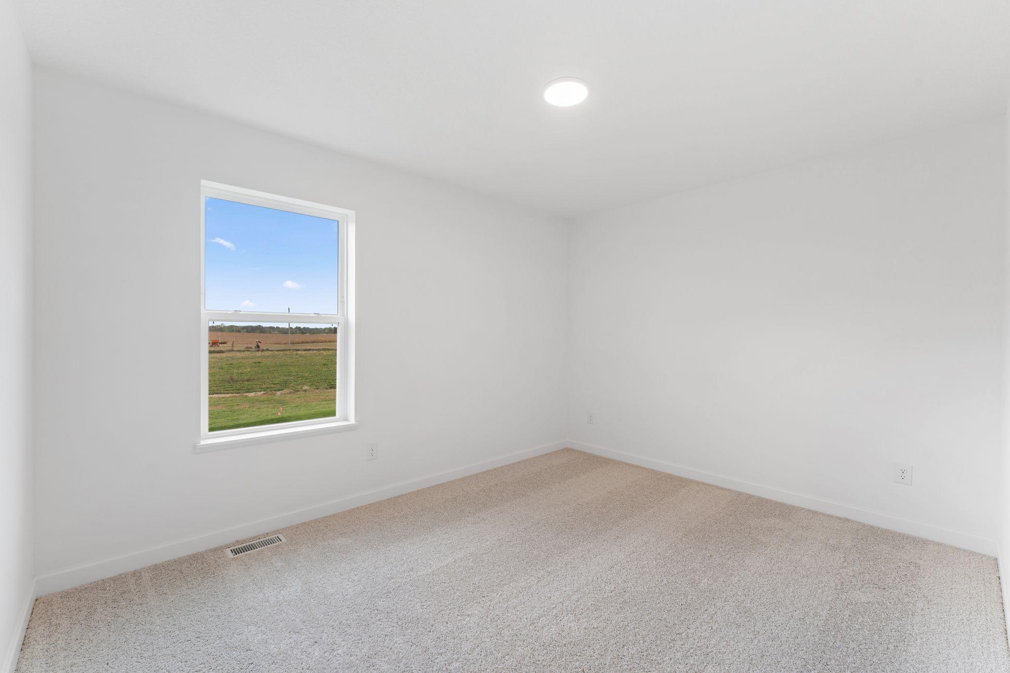 The secondary bedrooms offer peace and quiet after a busy day.