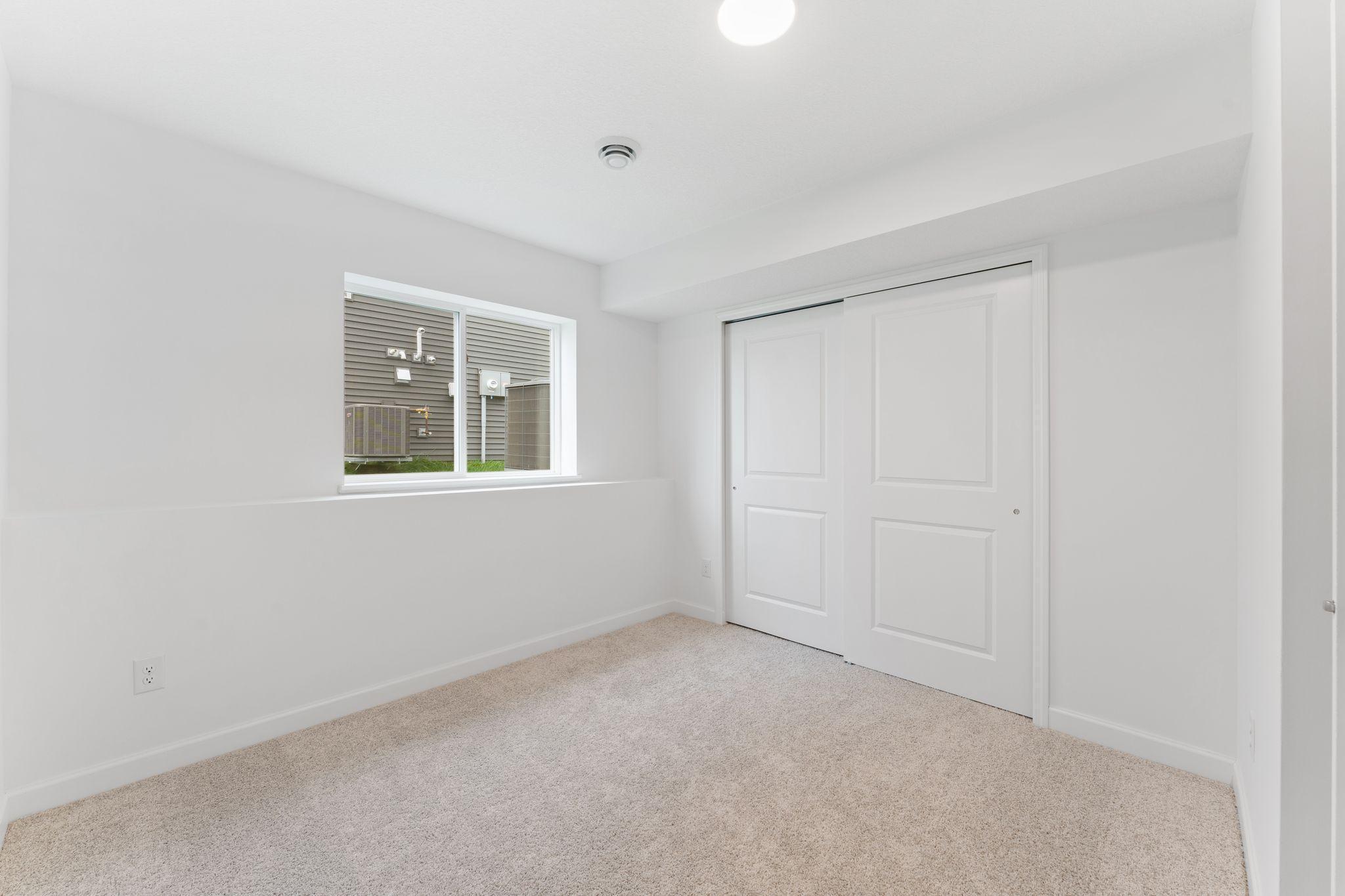 An additional secondary bedroom is included in the finished basement