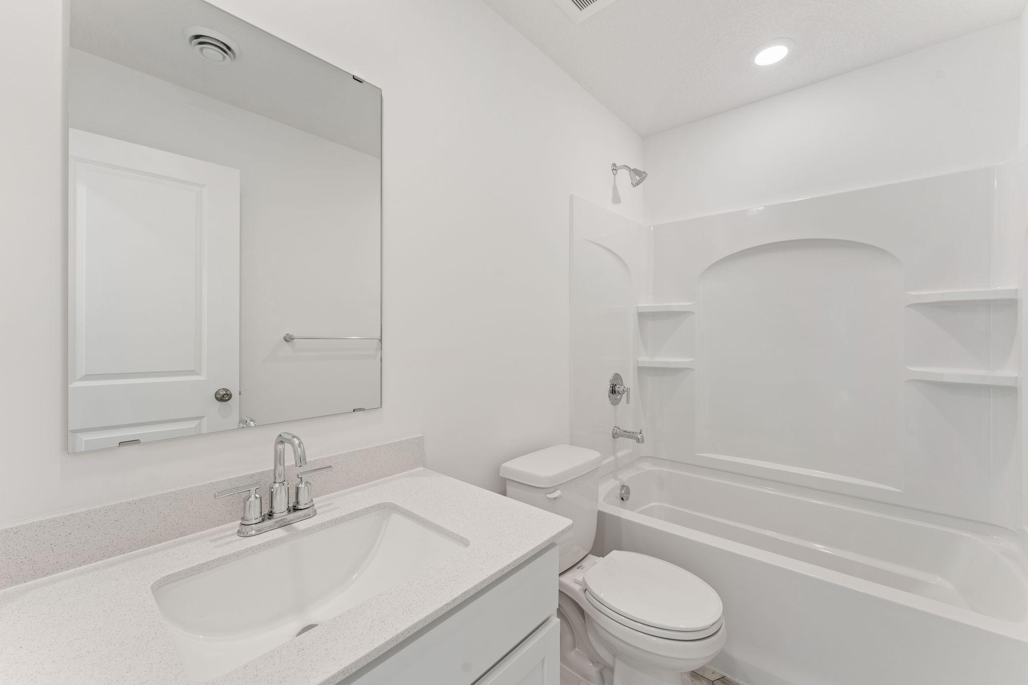 This full-sized bathroom is convenient for overnight guests staying in the adjacent secondary bedroom