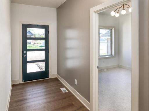 Front entry with paneled glass door