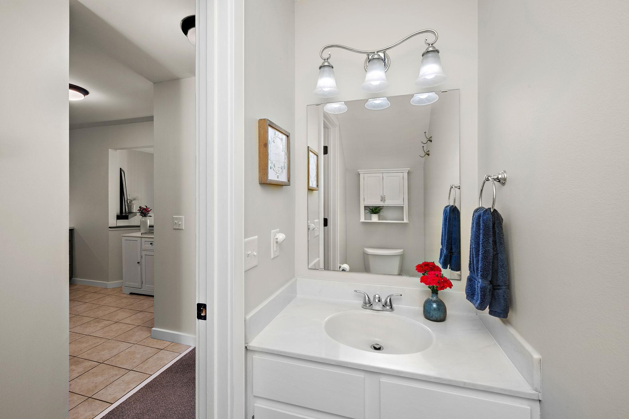 Convenient Main-Level Half Bath has clean finishes and thoughtful updates.