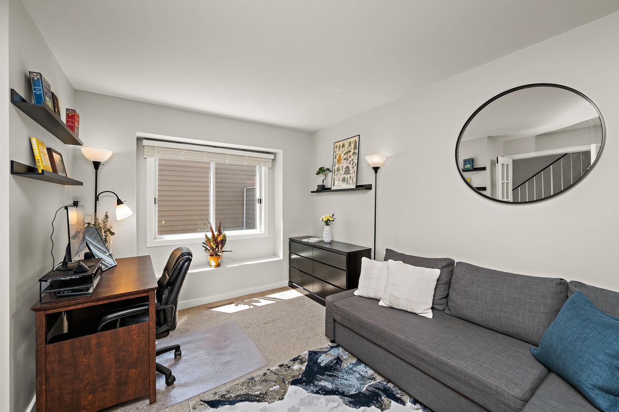 Versatile Main-Level Office/Bedroom has abundant natural light.