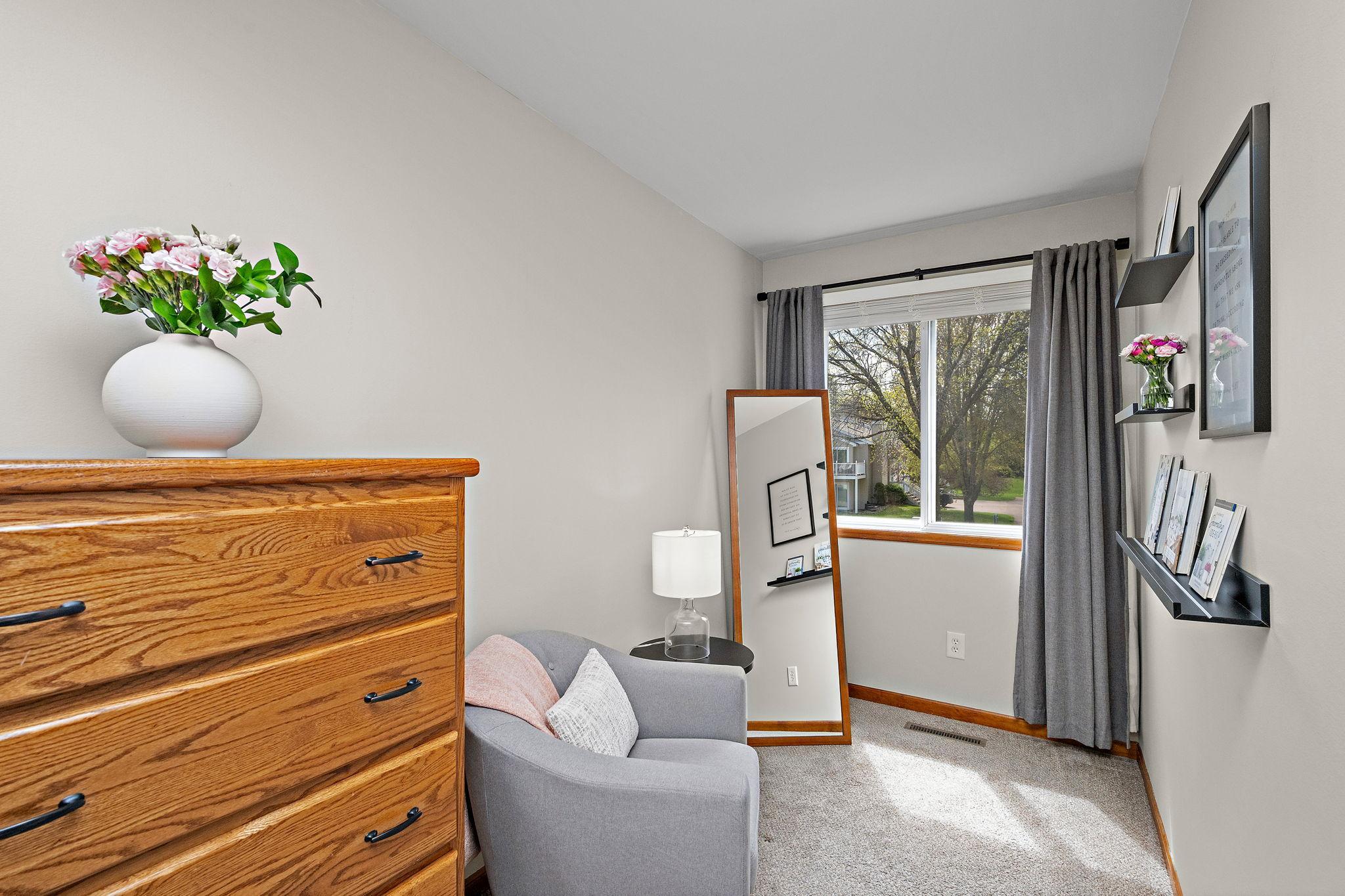 A Cozy Tucked-Away Nook adds charm and flexibility to the primary bedroom - perfect for reading or relaxing.