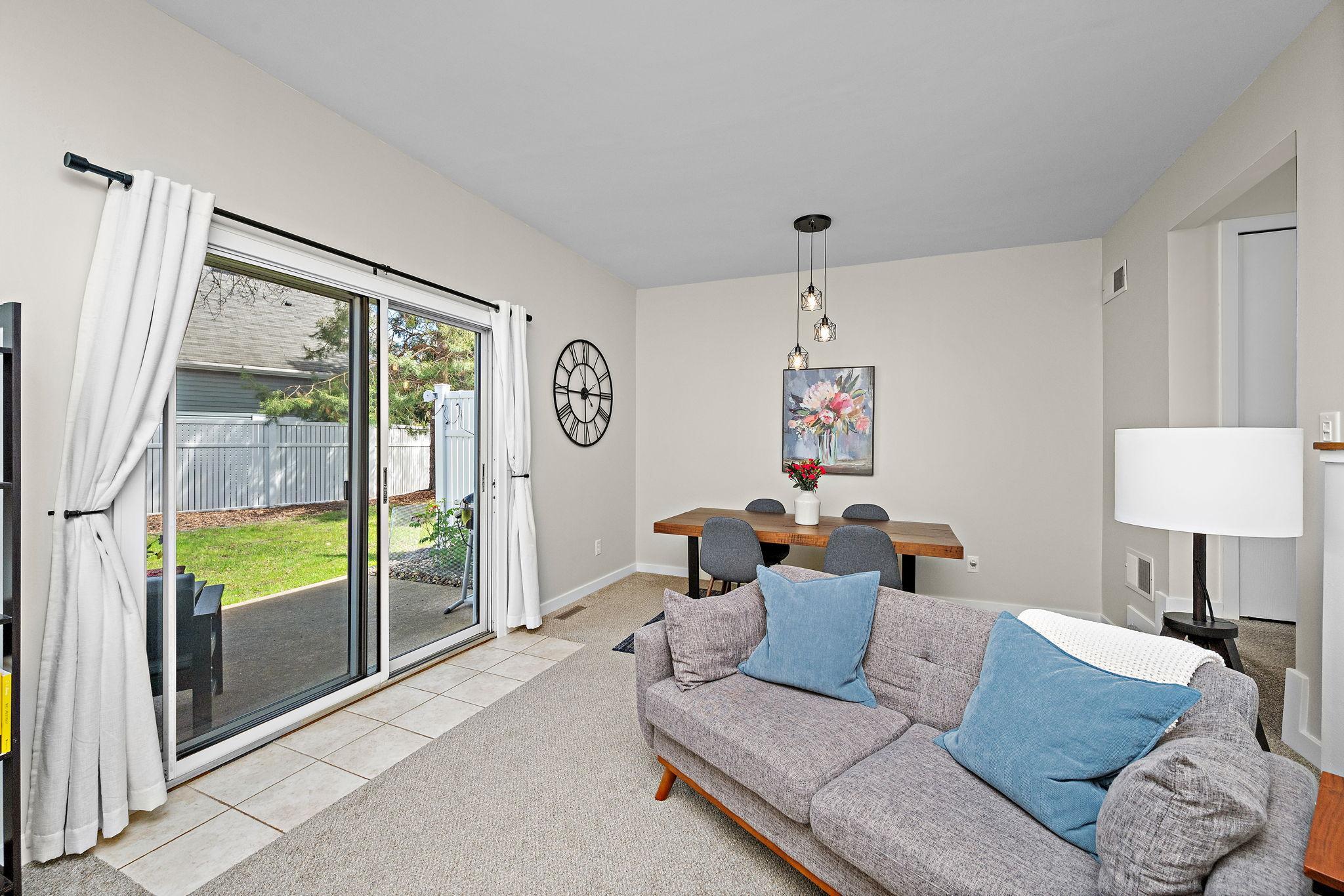 Natural Light pours in through sliding doors while seamlessly connecting the indoor and outdoor living space.