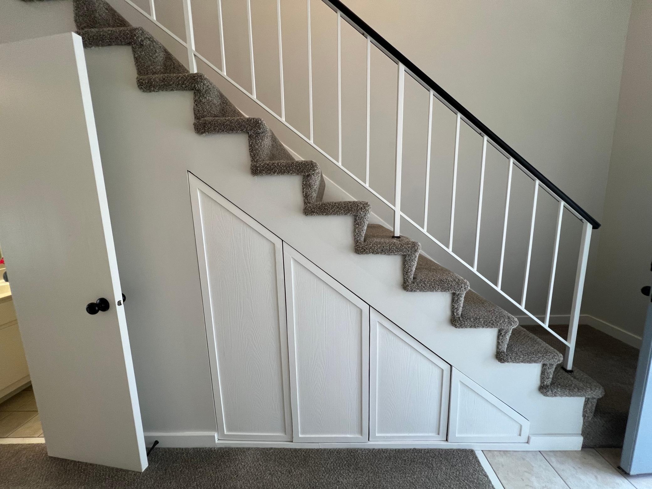 Clever Under-Stair Storage provides the perfect spot to keep everything neatly tucked away.