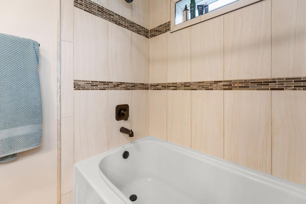 Modern tiled surround, transom window for daylight