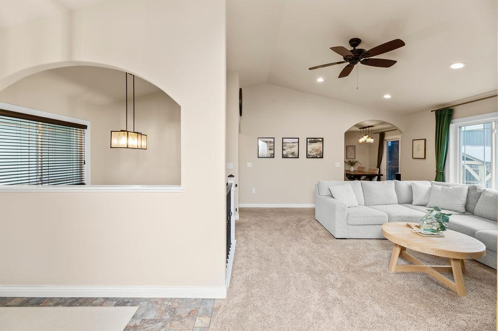 Foyer, stairs, living room, view to dining & kitchen