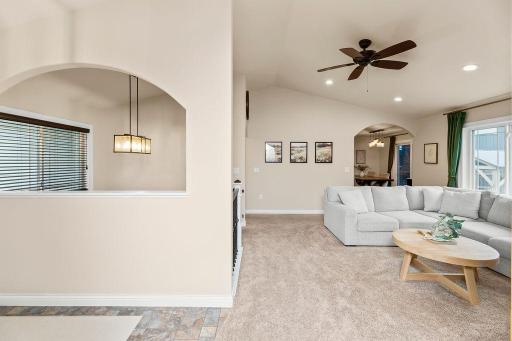 Foyer, stairs, living room, view to dining & kitchen