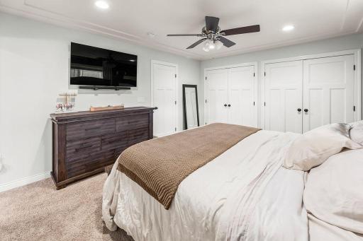 Primary offers recessed lighting, ceiling accent trim, ceiling fan & dual his & hers closets