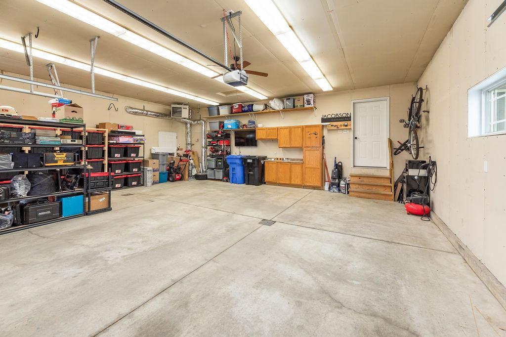 Finished 3-stall Garage w/ gas heat, storage cabinets, floor drain
