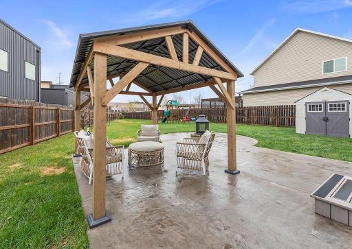 Cozy, covered seating area on your concrete stamped patio!