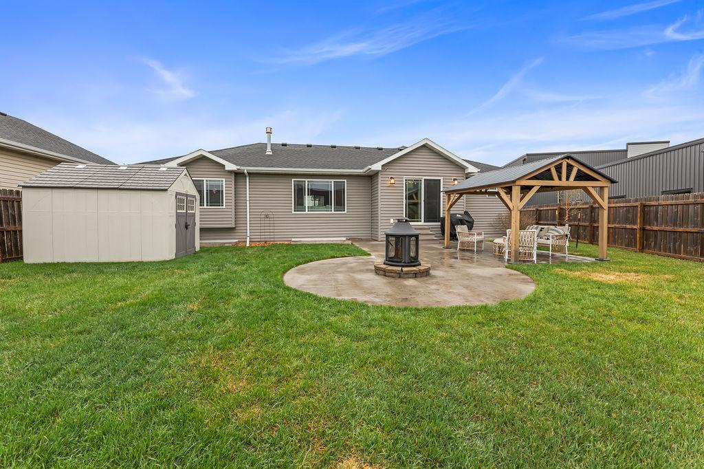Backyard, storage shed, concrete patio