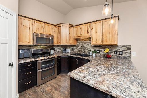 Hickory upper cabinets paired with dark wood lowers