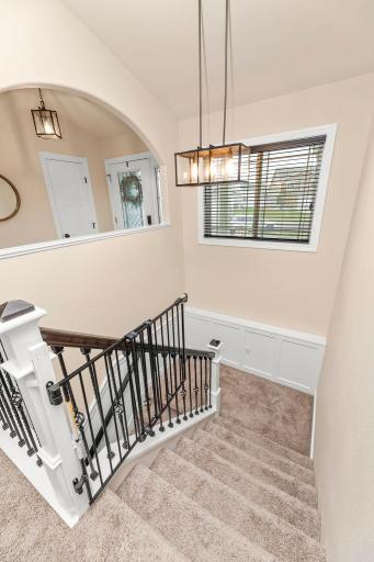 Modern railing system & large window for the downstairs staircase
