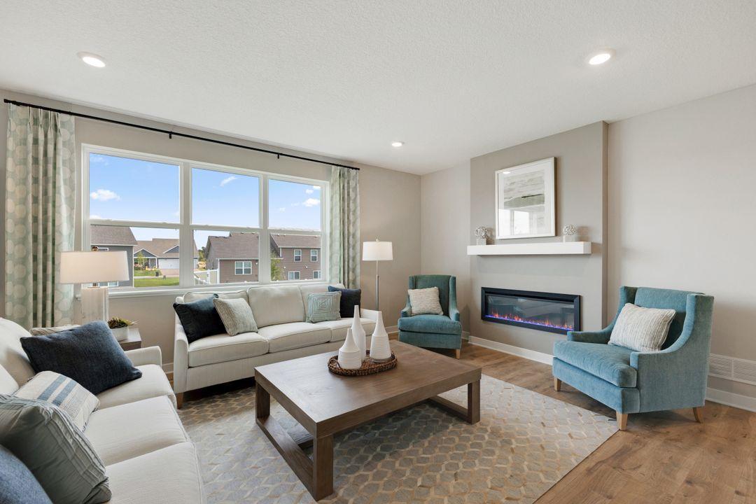 Enough room for two large couches and two pleasant chairs, this living room has ample seating for all the gatherings.