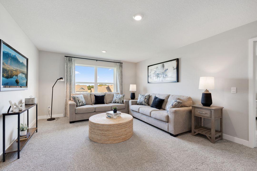 Greeting you at the top of stairs is an oversized loft space which is a great place for those informal or end of the day relaxation time.