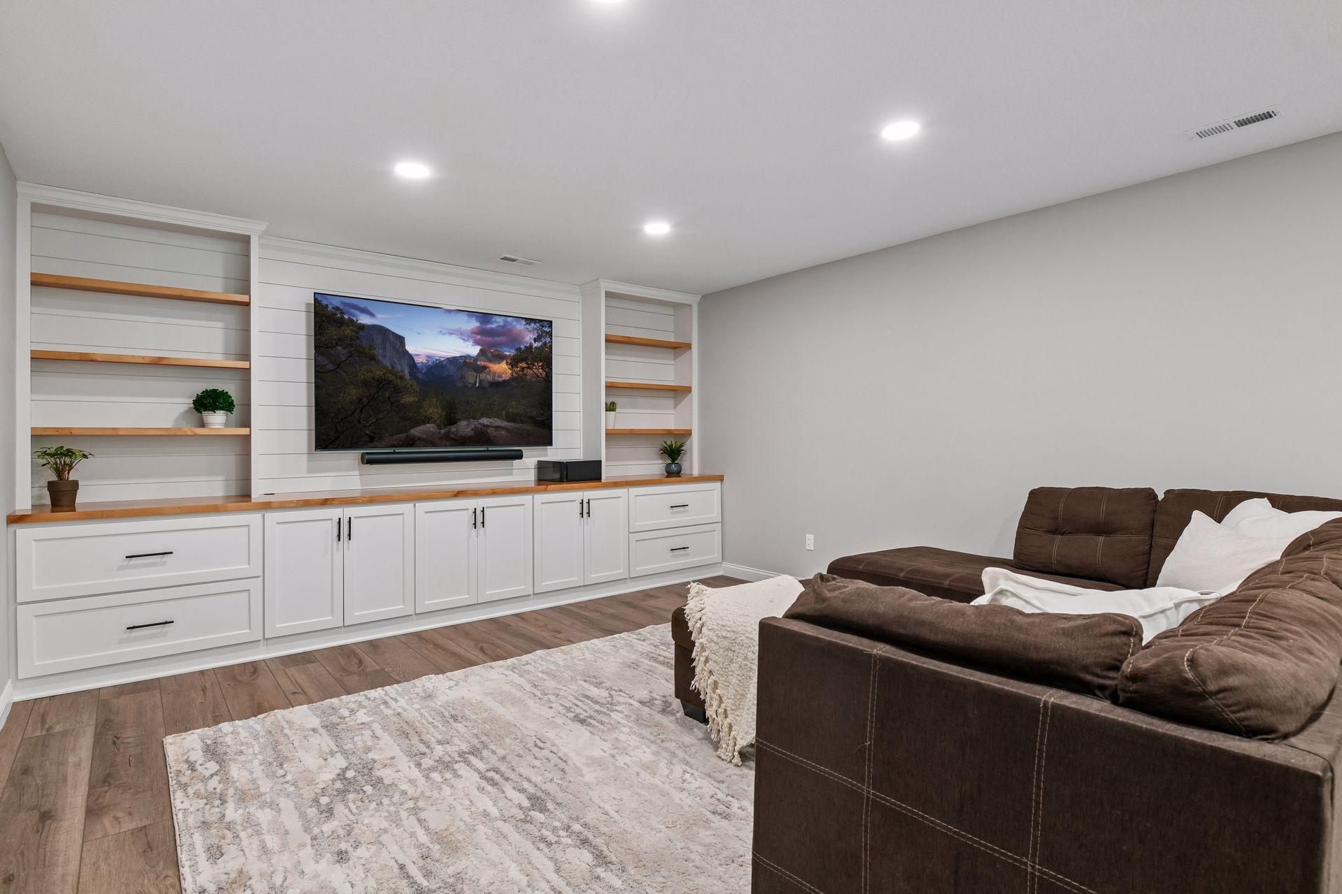 Lower level recreation area with recessed lighting open to adjoining family room