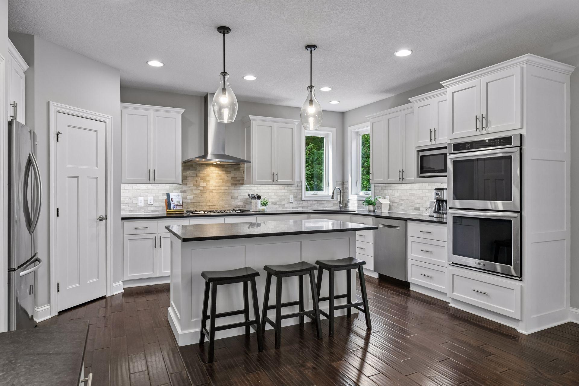 Kitchen with granite center island and gourmet kitchen.