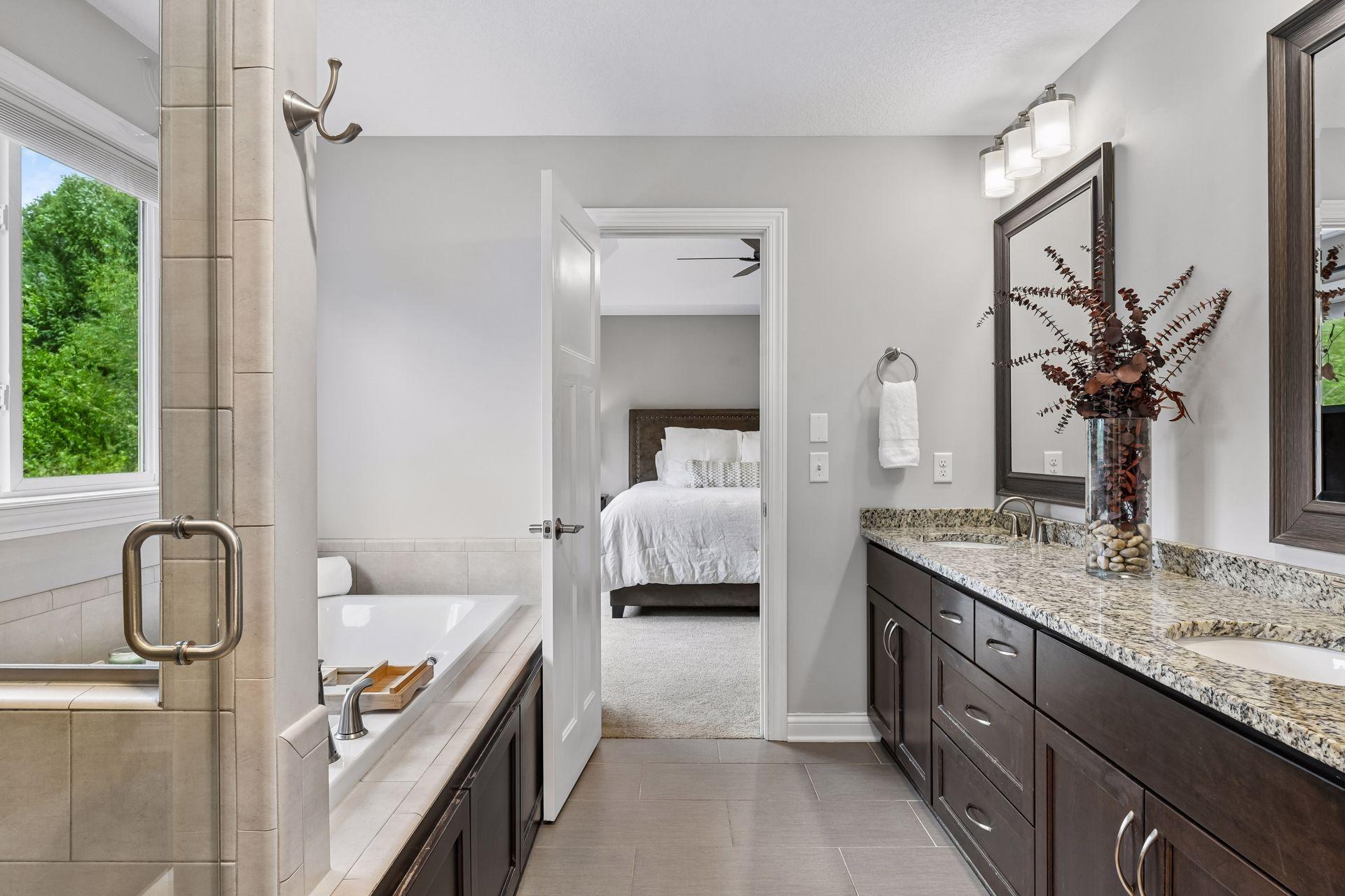 Primary bath with soaking tub, and large tiled shower surround