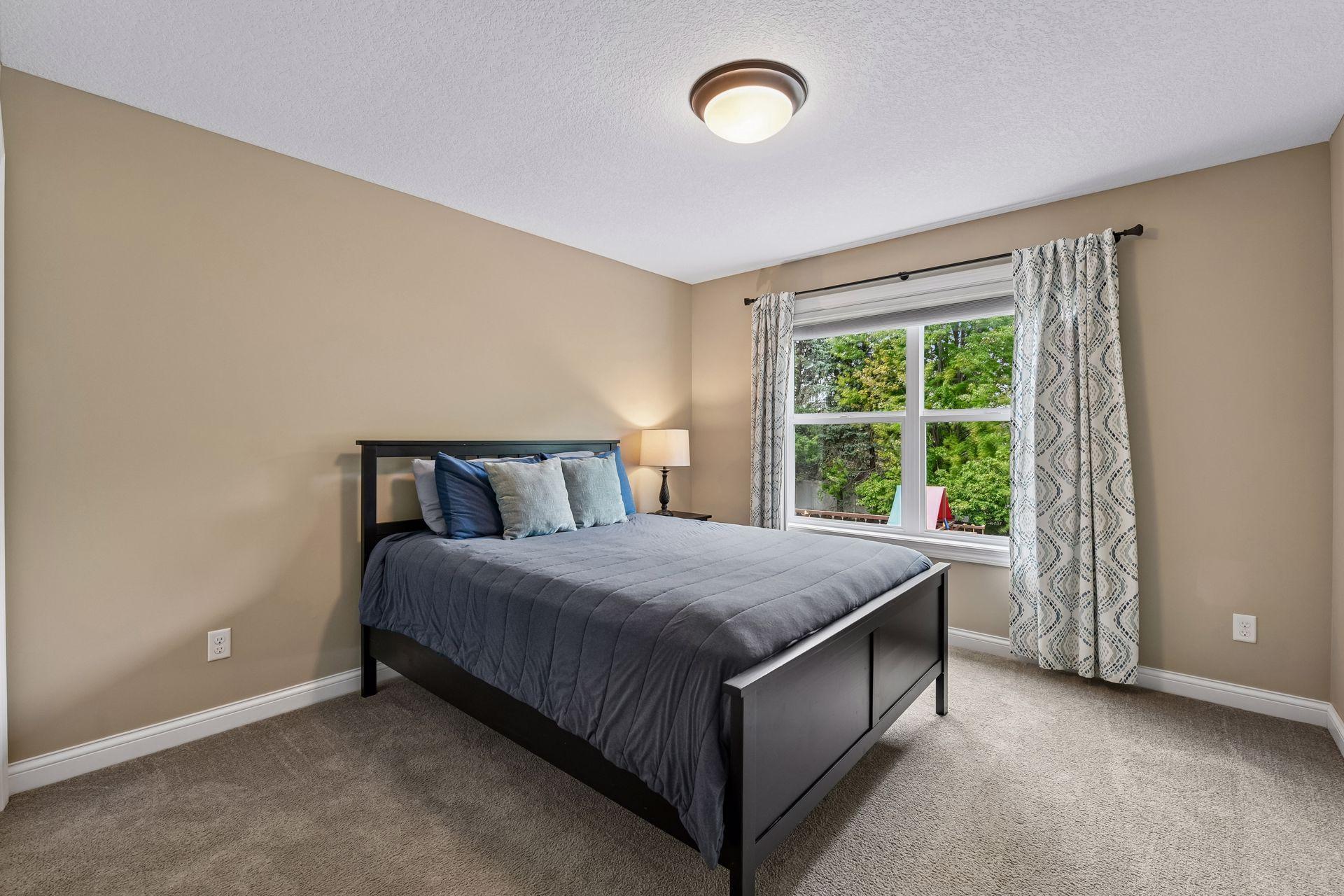 Upstairs bedroom with closet and views out the front.