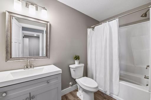Lower level bathroom complete with updated vanity and shower/tub combo