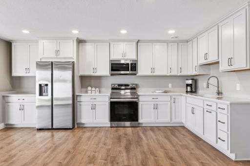 Lower level is built for multigenerational living with full kitchen and two non-conforming bedroom spaces