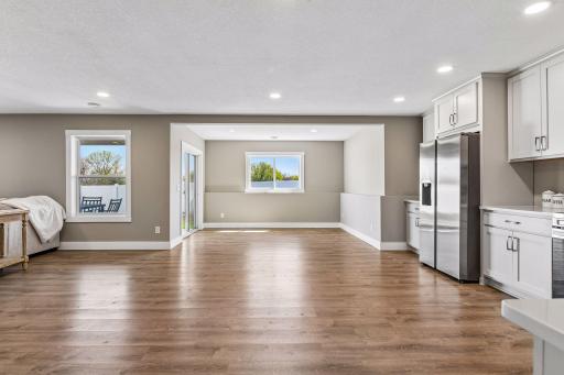 Walkout lower level is flooded with natural light. Just off sliding glass door is 10x20 maintenance free deck