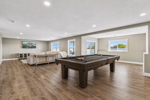 Walkout lower level is flooded with natural light. Just off sliding glass door is 10x20 maintenance free deck