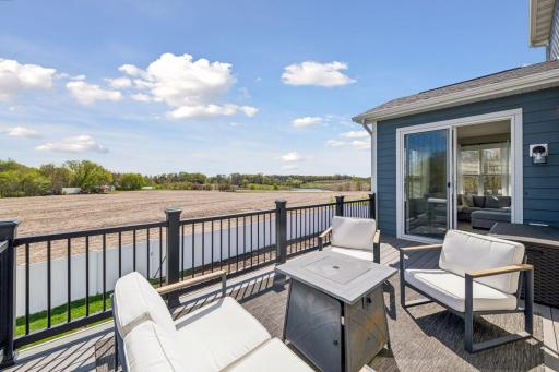 Private eastern facing views from the upper level 10x20 maintenance free deck with private backyard