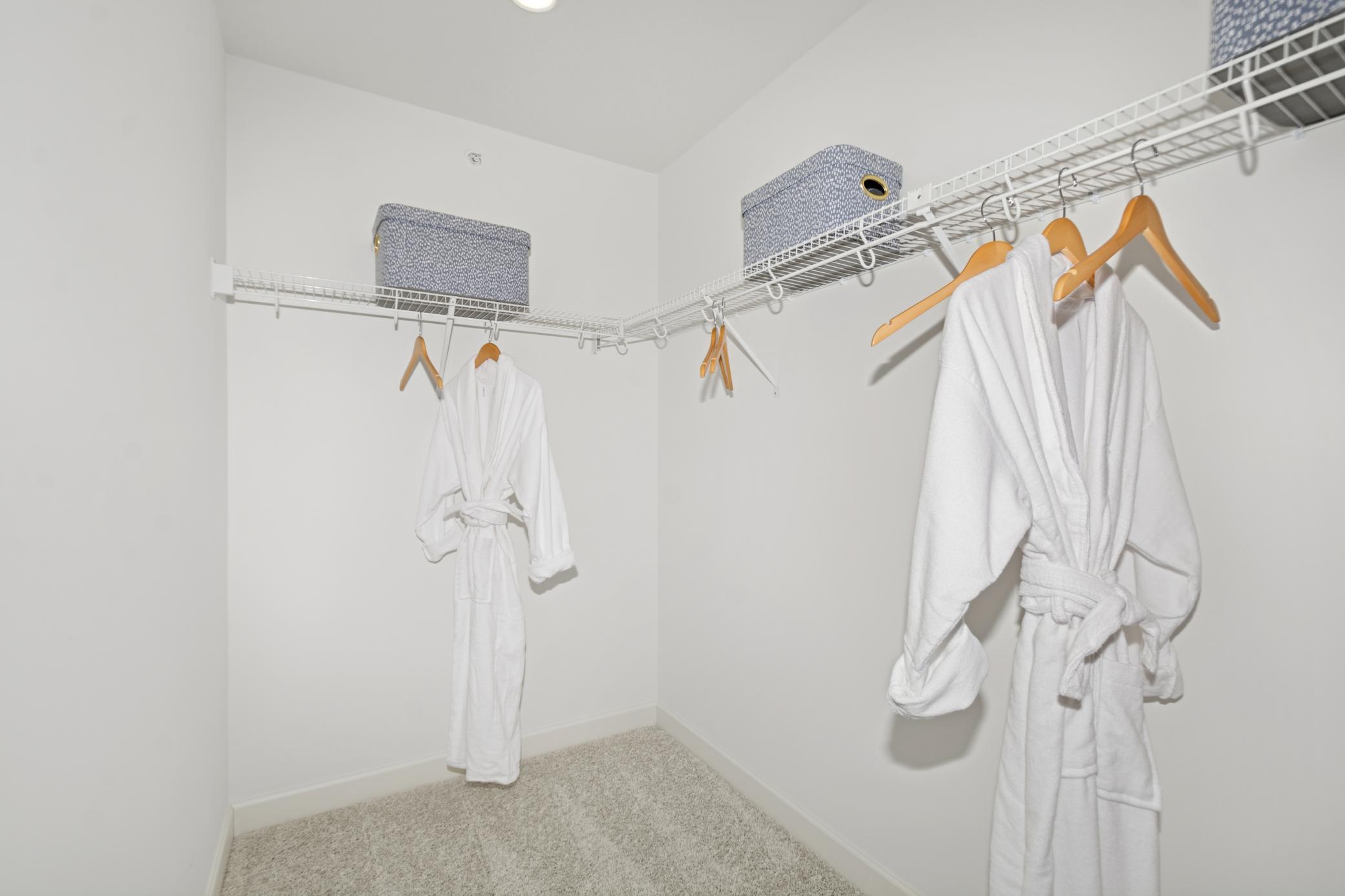 (Photo of model home, features will vary) A large walk-in closet with mesh-wire shelving provides abundant room to store wardrobes, shoes, accessories and much more