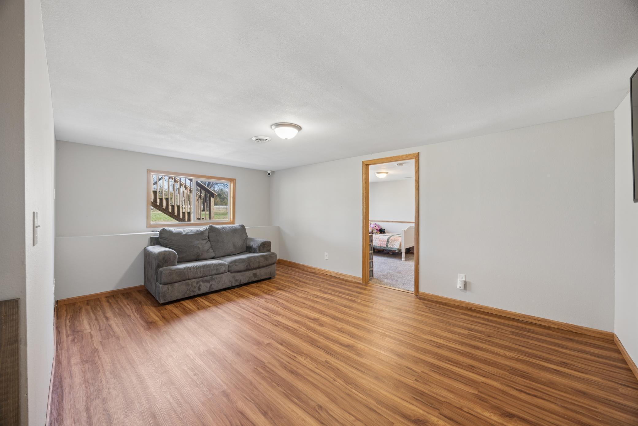 Large family room offers both space and function! Plenty of room here! Perfect for a movie night or add a table for a game area! lots of possibilities