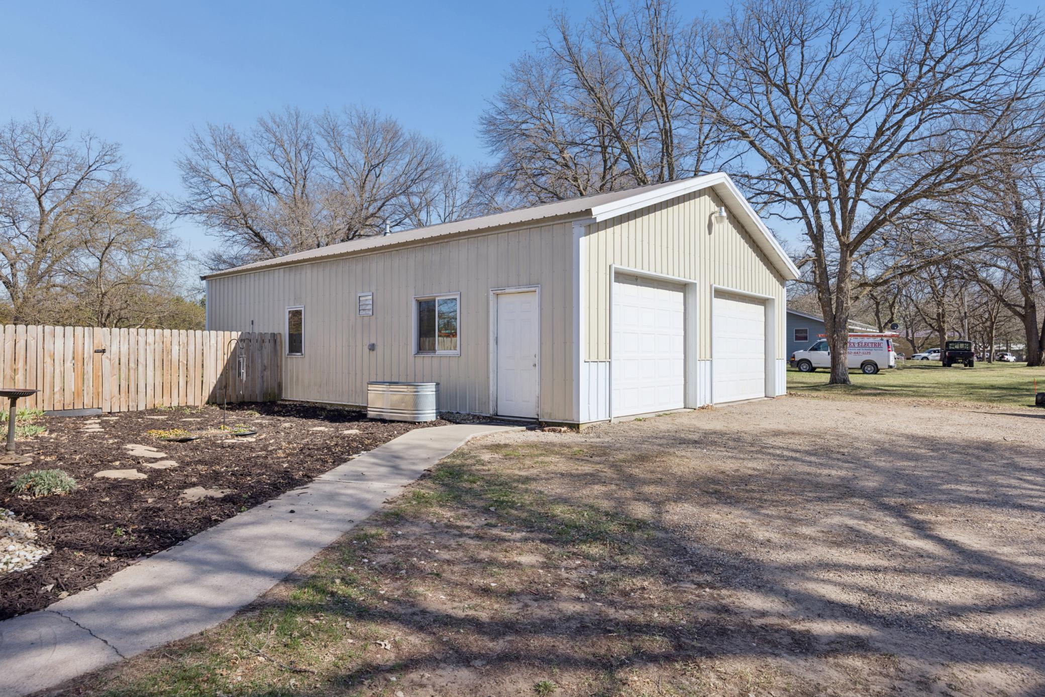 AWESOME 30x40 detached garage complete with heat, AC, floor drain, concrete flooring, and also a cold storage space! This is a DREAM!
